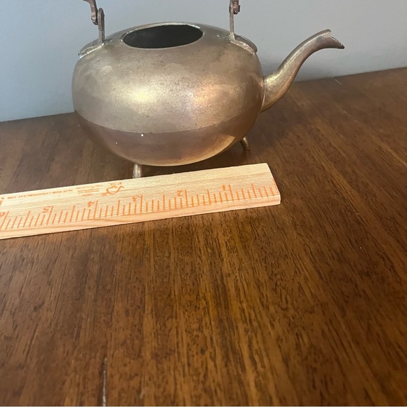 antique brass kettle with a wooden handle and three-legged base. - Picture 4 of 6